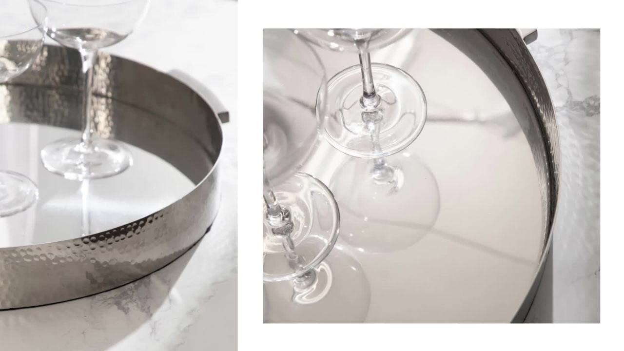 thumbnail video image 2 of Kate and Laurel Samana Modern Glam Round Metal Tray, 17 Inch Diameter, Gray Gunmetal, Polished Decorative Circle Tray with Hammered Surface for Use as Ottoman Tray or Serving Tray, 2 of 9