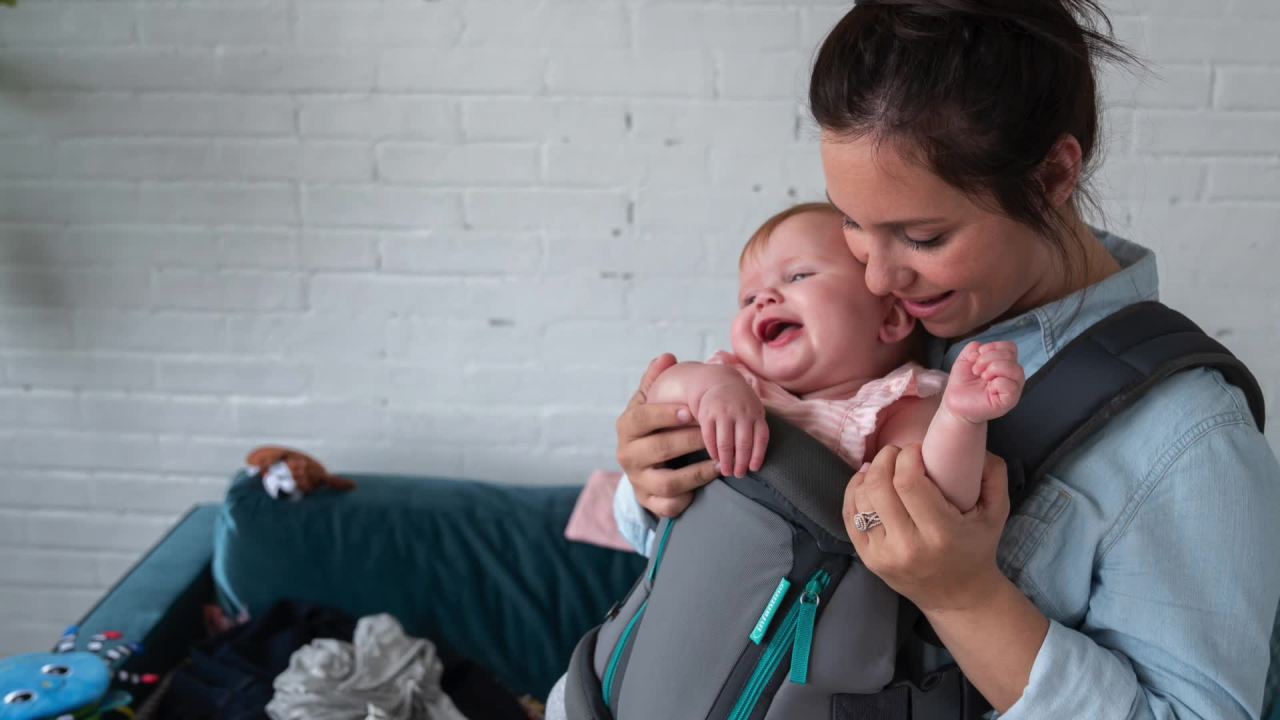 thumbnail video image 2 of Infantino Swift Classic Multi-Pocket Convertible Baby Carrier, Inward & Outward Facing, Black, 2 of 9