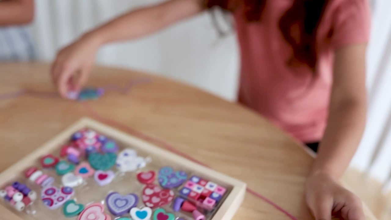 thumbnail video image 2 of Melissa & Doug Sweet Hearts and Butterfly Friends Bead Set of 2 - 250+ Wooden Beads, 2 of 10