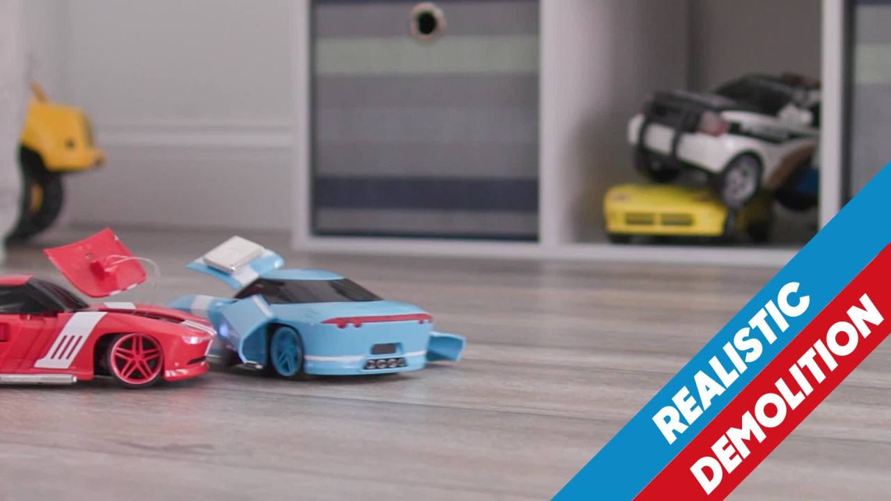 thumbnail video image 2 of Sharper Image® Toy RC Body Shop Remote Control Demolition Car 2 Pack with Pop-on Parts, 2.4 GHz Long Range Wireless Control, Blue/Red, Age 6+, 2 of 11