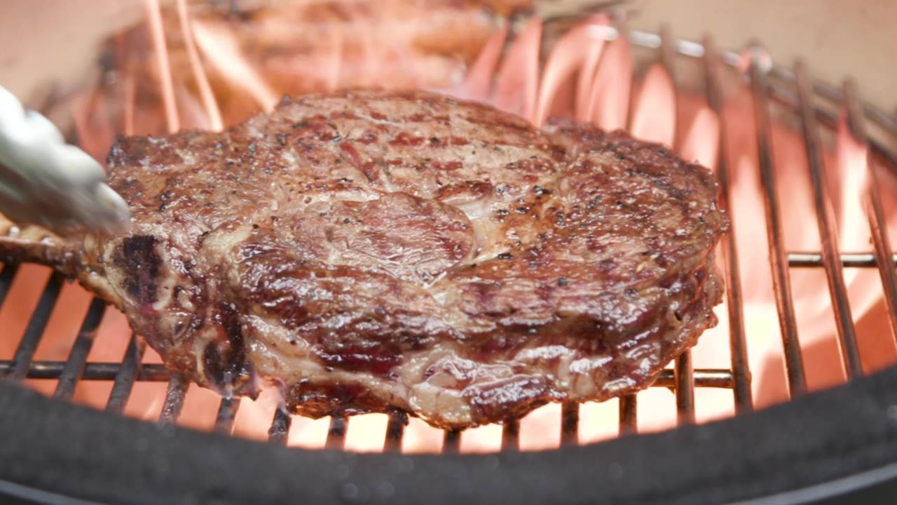 thumbnail video image 2 of Kamado Joe Joe Jr. 13.5 in. Portable Charcoal Grill in Red with Cast Iron Cart, Heat Deflectors and Ash Tool, 2 of 11