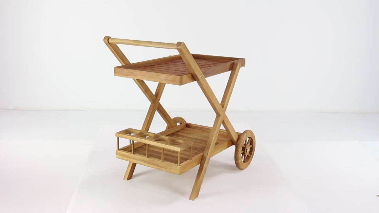thumbnail video image 2 of DecMode 32" x 32" Brown Teak Wood Indoor Outdoor Rolling 2 Shelves Bar Cart with Wheels and Handle, 1-Piece, 2 of 12