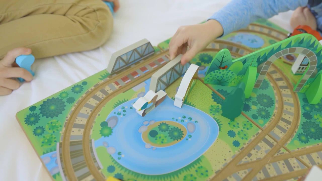 thumbnail video image 3 of Melissa & Doug 17-Piece Wooden Take-Along Tabletop Railroad and Trains, for Kids and Toddlers 3+, 3 of 11