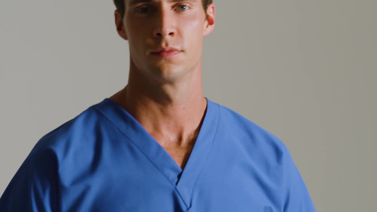 thumbnail video image 2 of Landau Unisex Reversible Dolman Sleeve V-Neck Scrub Top, Style 7502, 2 of 4