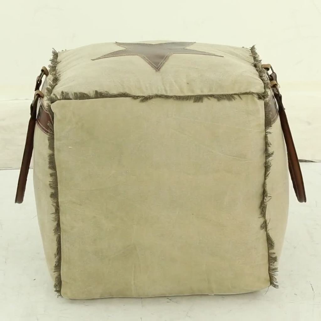 thumbnail video image 2 of DecMode Rustic and Organic Square Ottoman Fabric Pouf features White Canvas and Brown Leather Handles with "Lonely Wolf" and Star Designs, 20"W x 19"H, 2 of 15