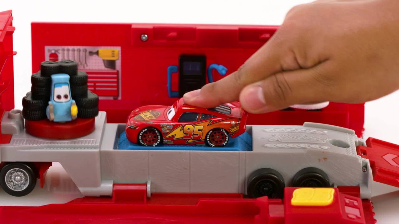 thumbnail video image 2 of Disney Pixar Cars Transforming Mack Playset, 2-in-1 toy Truck & Tune-Up Station with Launcher, 2 of 7