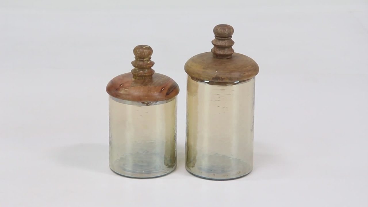 thumbnail video image 2 of DecMode 8", 11"H Gold Glass Decorative Jars with Wood Lids, 2-Pieces, 2 of 8