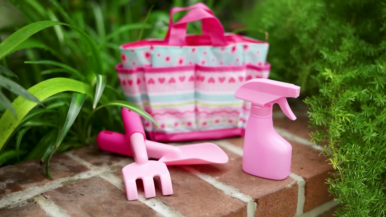thumbnail video image 2 of Melissa & Doug Sunny Patch Pretty Petals Gardening Tote Set With Tools, 2 of 10