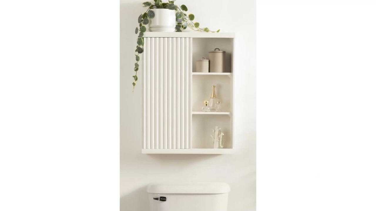 thumbnail video image 2 of Kate and Laurel Furrow Modern Wooden Ribbed Sliding Door Tall Wall Cabinet, 22 x 7 x 28, White, Floating Bathroom Cabinet with Sliding Door for Use as Over-the-Toilet Storage or Kitchen Spice Rack, 2 of 10