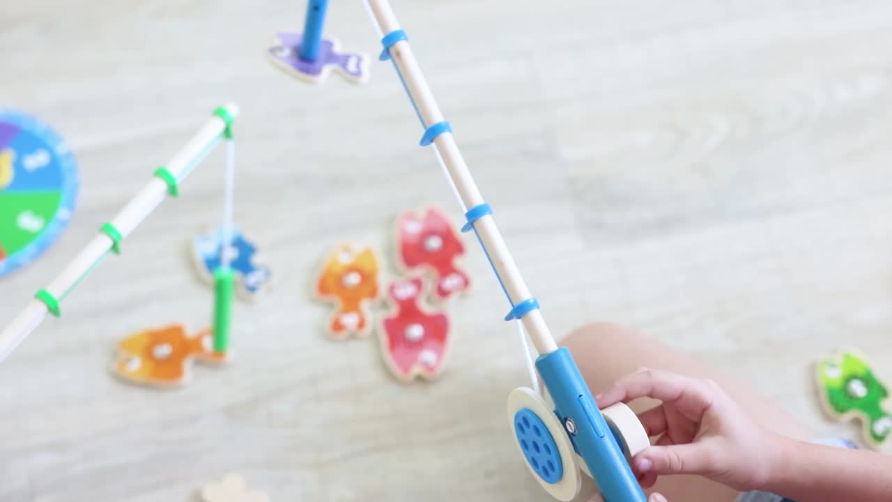 thumbnail video image 2 of Melissa & Doug Catch & Count Wooden Fishing Game with 2 Magnetic Toy Rods - FSC Certified, 2 of 8