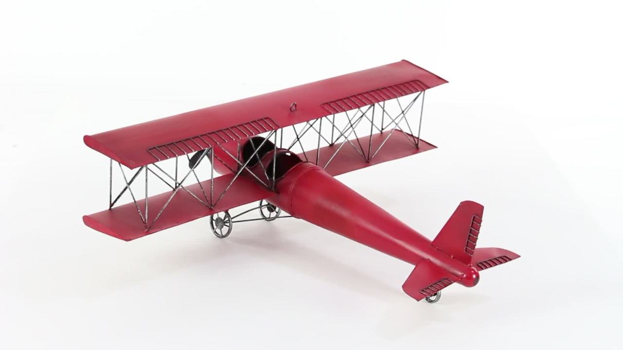 thumbnail video image 2 of DecMode Vitange Metal Hanging Red Airplane Wall Décor, 28"W x 11"H, 2 of 11