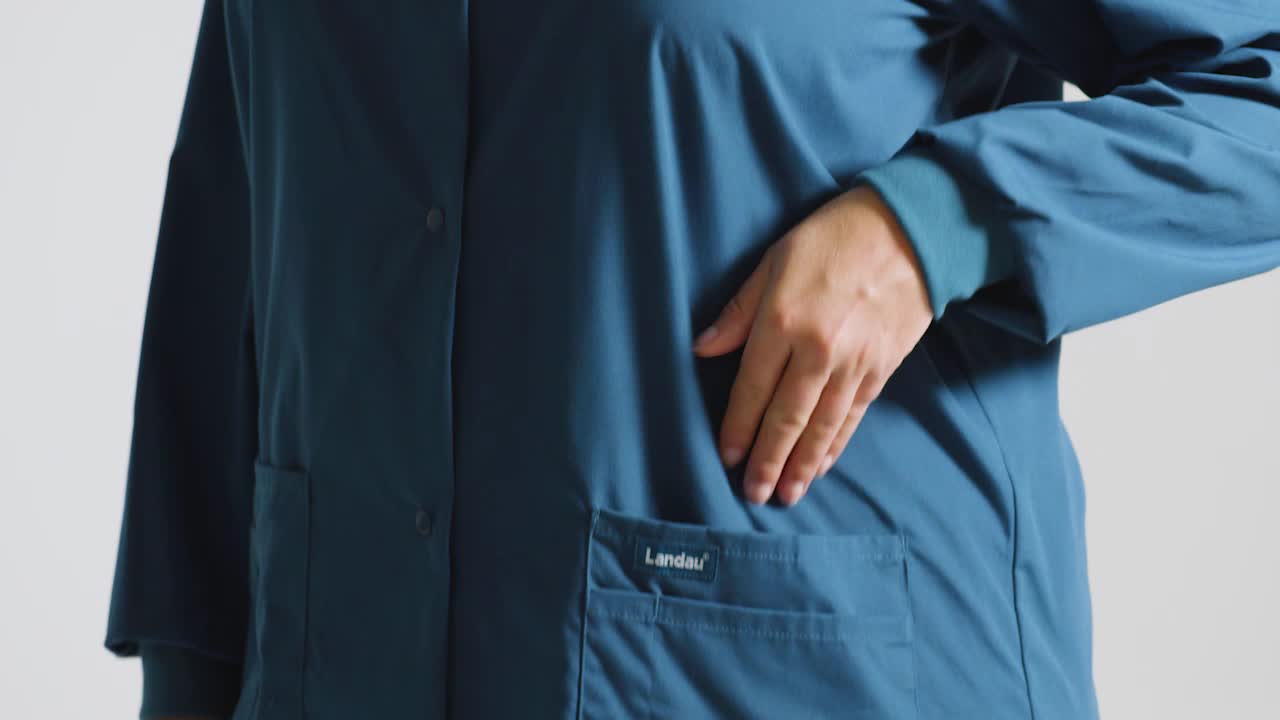 thumbnail video image 2 of Landau Women's Snap Front Warm-up Scrub Jacket, 2 of 5