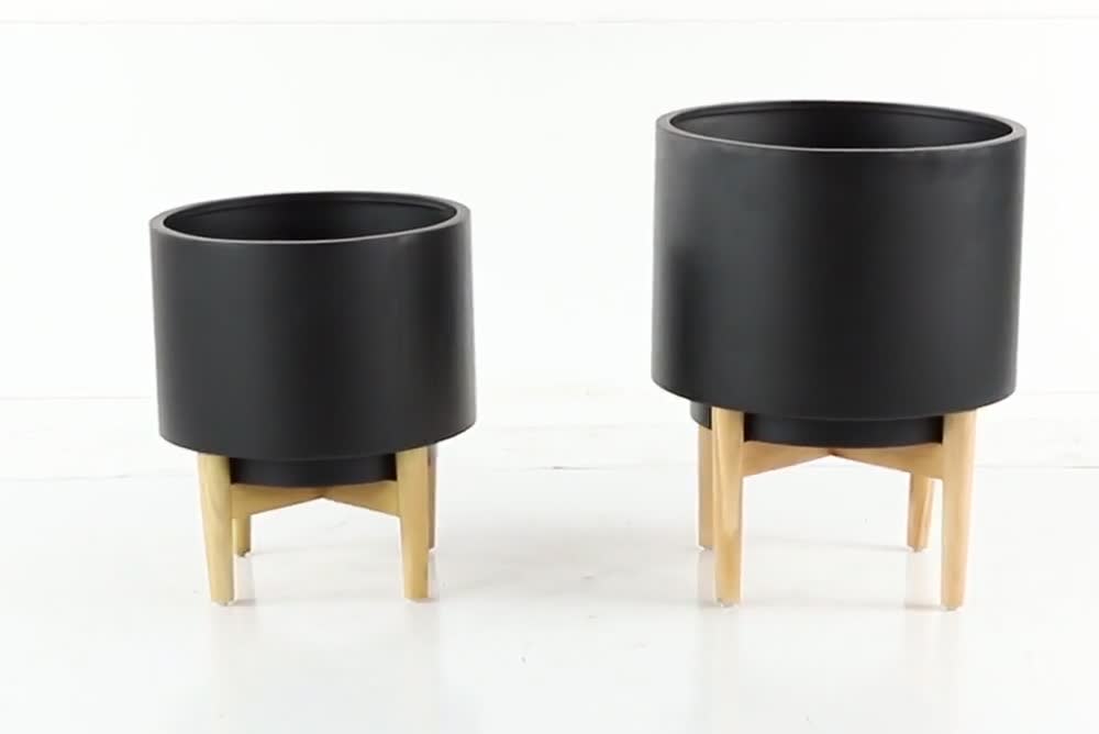 thumbnail video image 2 of CosmoLiving by Cosmopolitan 20", 16"H Indoor Outdoor Black Metal Planter with Removable Wood Stand (2 Count), 2 of 9