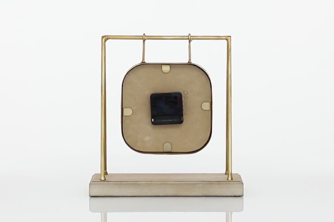 thumbnail video image 2 of DecMode 11" Gold Metal Suspended Hanging Clock with Wood Base, 2 of 8