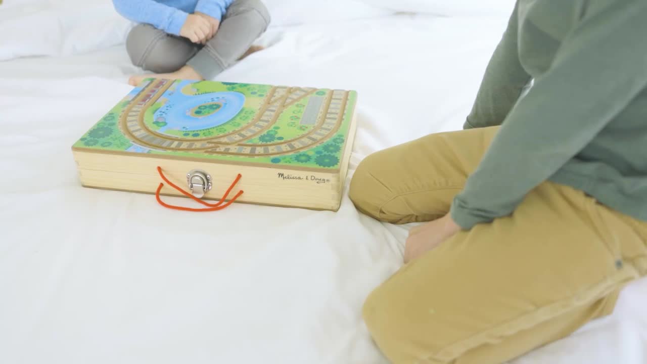 thumbnail video image 2 of Melissa & Doug 17-Piece Wooden Take-Along Tabletop Railroad and Trains, for Kids and Toddlers 3+, 2 of 10