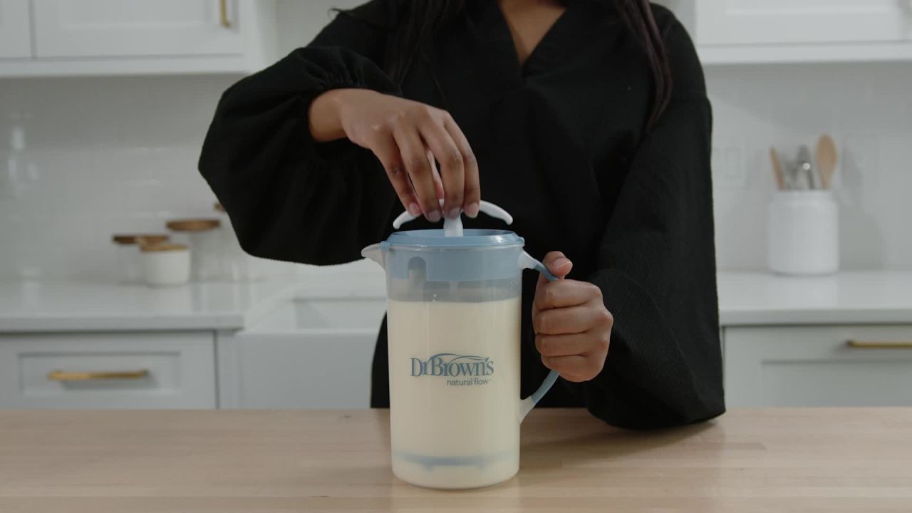 thumbnail video image 3 of Dr. Brown's Baby Formula Mixing Pitcher, Adjustable Stopper/Locking Lid/No-Drip Spout, Blue 36oz, 1 Pack, 3 of 11
