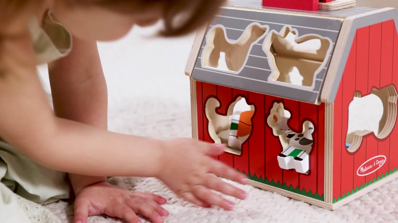 thumbnail video image 3 of Melissa & Doug Wooden Take-Along Sorting Barn Toy with Flip-Up Roof and Handle 10 Wooden Farm Play Pieces, 3 of 12