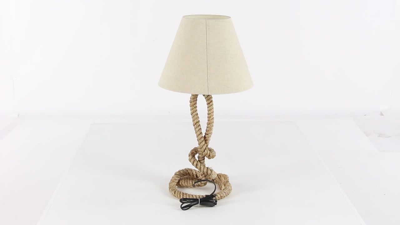 thumbnail video image 2 of DecMode 29" Twisted Rope Knot Brown Table Lamp with Cream Fabric Shade, 2 of 11
