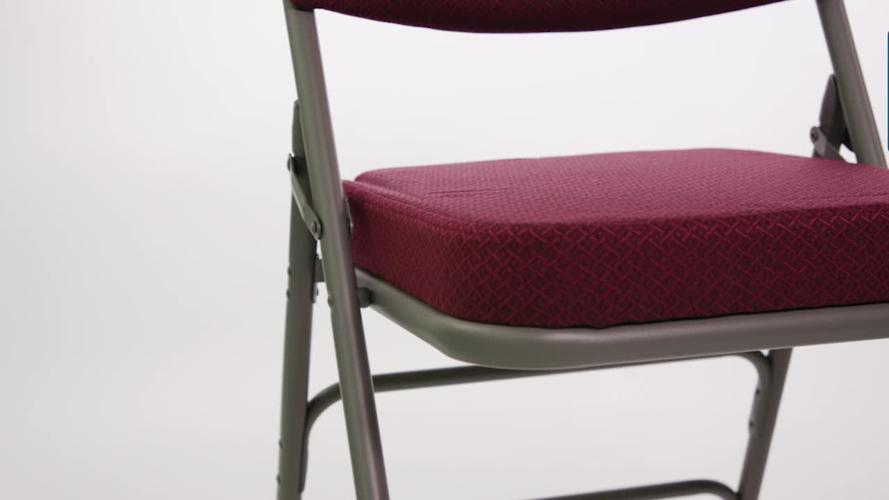 thumbnail video image 2 of Flash Furniture HERCULES Series Premium Curved Triple Braced & Double Hinged Burgundy Fabric Metal Folding Chair, 2 of 13