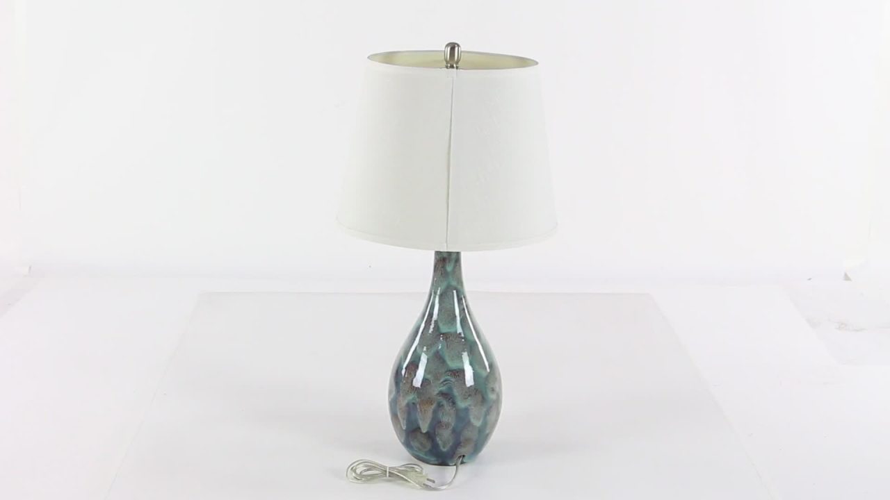 thumbnail video image 2 of DecMode 32" Textured Abstract Teal Table Lamp with Cream Linen Shade (2 Count), 2 of 10