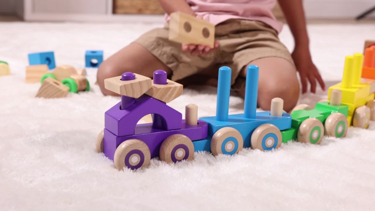thumbnail video image 2 of Melissa & Doug Deluxe Wooden Stacking Train, 32 Inch Length, 6 Cars, 19 Blocks, 2 Vehicles, for Toddlers 2+, 2 of 12