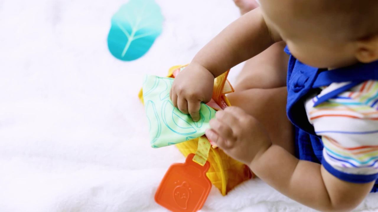 thumbnail video image 2 of Melissa & Doug Multi-Sensory Soft Taco Fill & Spill Infant Toy, 2 of 10