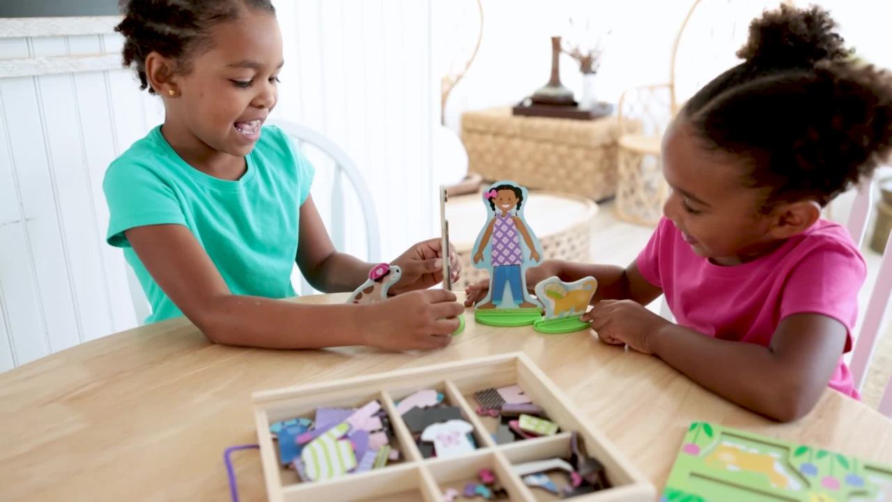 thumbnail video image 2 of Melissa & Doug Best Friends Magnetic Dress-Up Wooden Dolls Pretend Play Set, 2 of 10