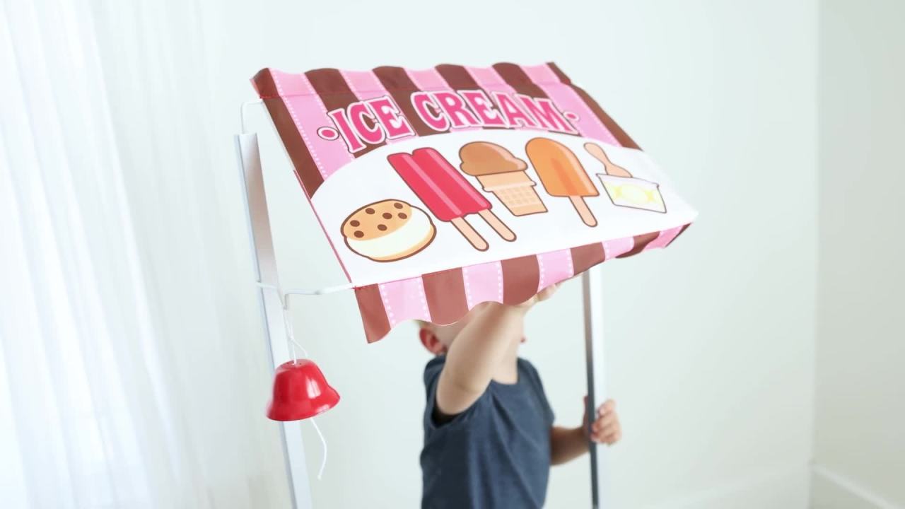 thumbnail video image 2 of Melissa & Doug Wooden Snacks and Sweets Food Cart - 40+ Play Food Pieces, Reversible Awning, 2 of 11