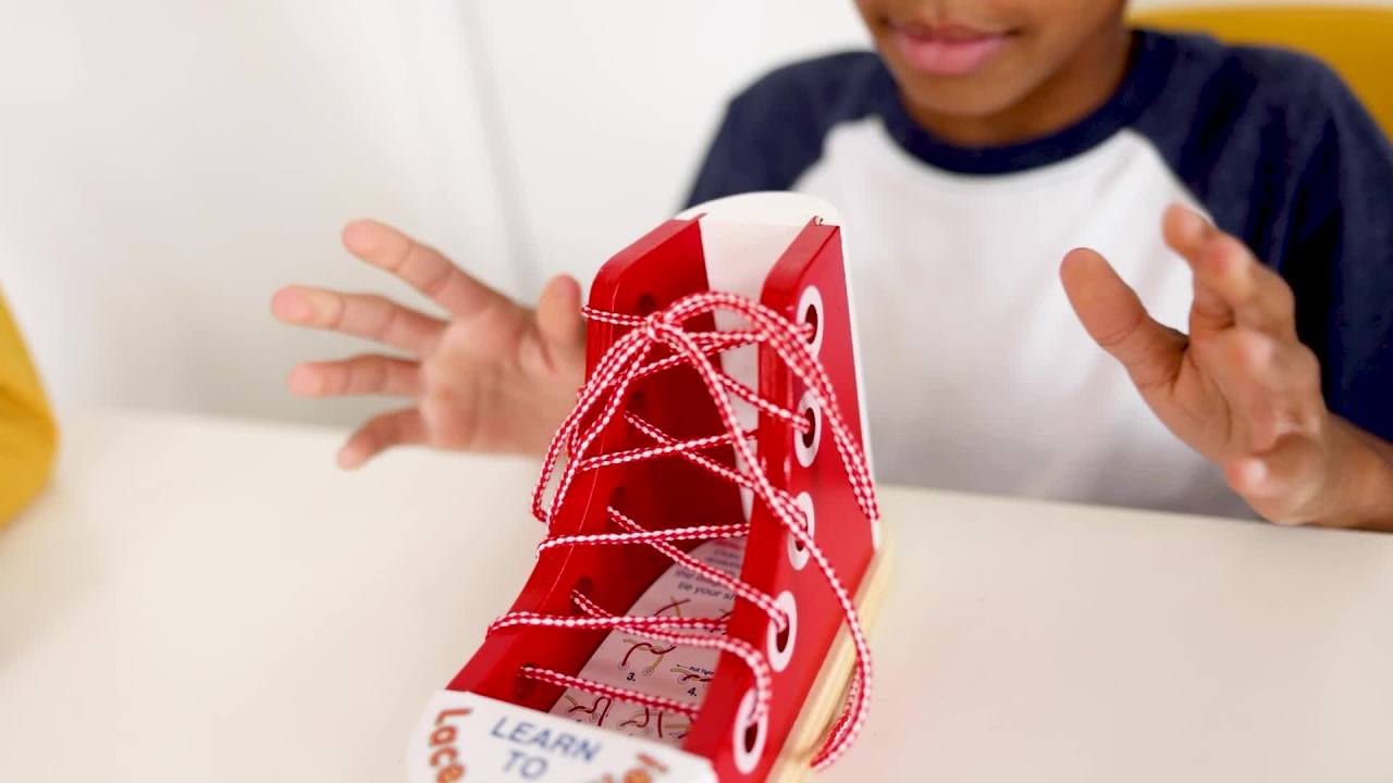 thumbnail video image 2 of Melissa & Doug Deluxe Wood Lacing Sneaker - Learn to Tie a Shoe Educational Toy, 2 of 10