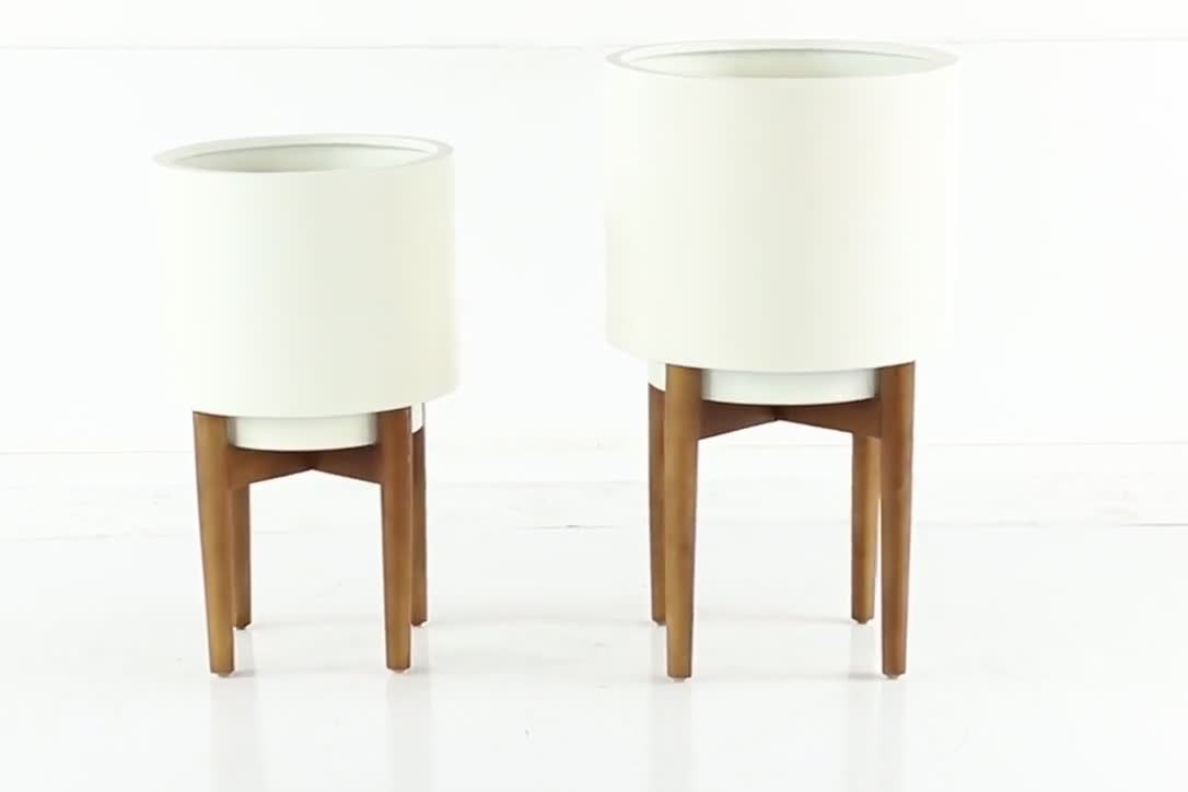 thumbnail video image 2 of CosmoLiving by Cosmopolitan 24", 20"H Indoor Outdoor White Metal Planter with Removable Wood Stand (2 Count), 2 of 9