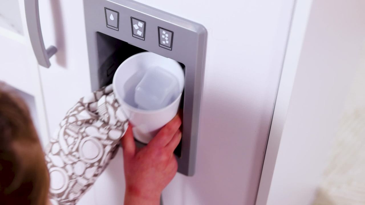 thumbnail video image 3 of Melissa & Doug Wooden Chef’s Pretend Play Toy Kitchen With “Ice” Cube Dispenser – Cloud White - FSC Certified, 3 of 11