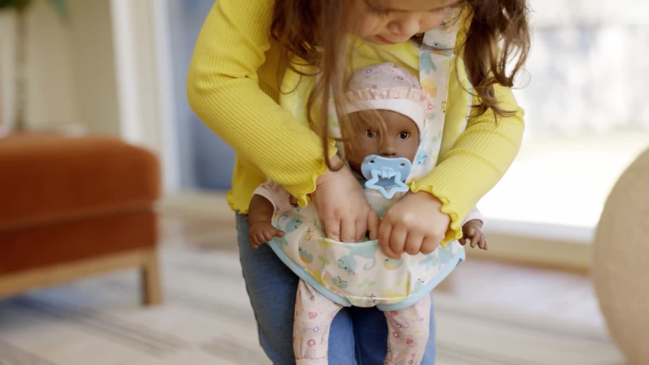 thumbnail video image 2 of Melissa & Doug Mine to Love Carrier Play Set for Baby Dolls with Toy Bear, Bottle, Rattle, Activity Card, 2 of 10