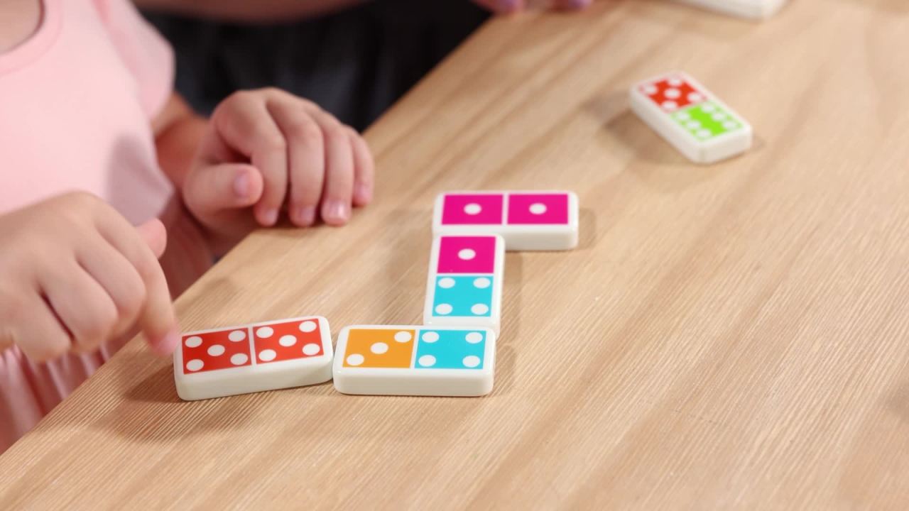 thumbnail video image 2 of Melissa & Doug Dominoes Tabletop Game with 28 Colorful Tiles in Wooden Storage Box, 2 of 10