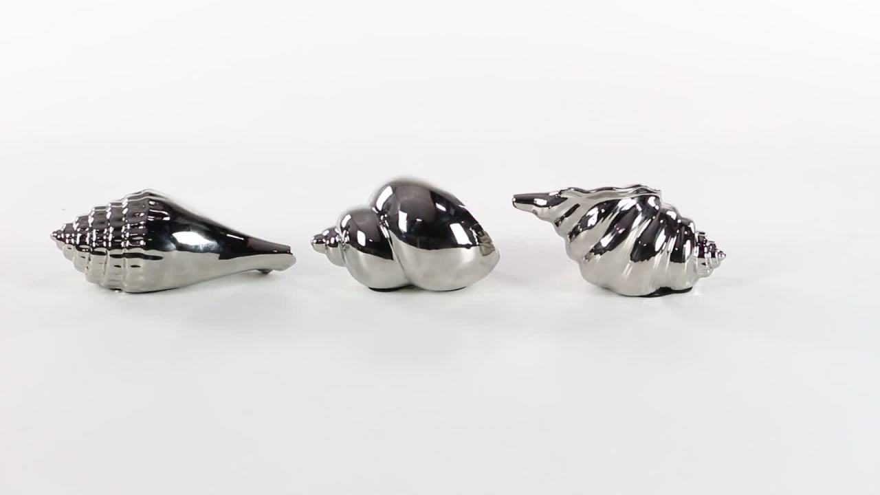 thumbnail video image 2 of 7", 7", 5"W Silver Ceramic Shell Shell Sculpture, by DecMode (3 Count), 2 of 21