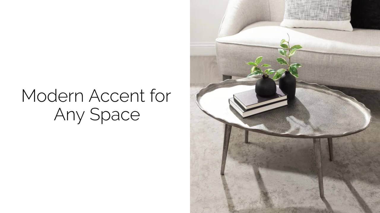 thumbnail video image 2 of Kate and Laurel Alessia Modern Glam Oval Coffee Table, 34 x 20 x 15, Silver, Metal Living Room Table for Storage and Display with Antique Deckled Edge Detailing, 2 of 8