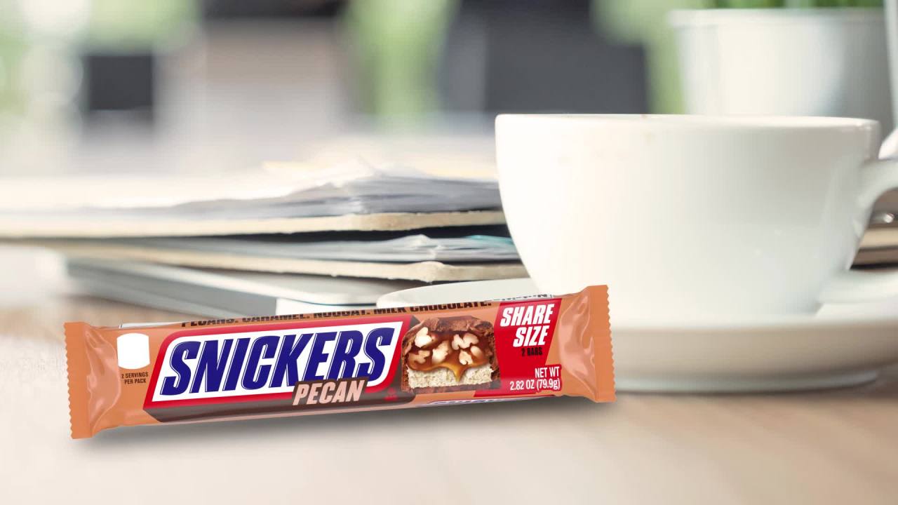 thumbnail video image 2 of Snickers Pecan Milk Chocolate Bar, Share Size - 2.82 oz, 2 of 7