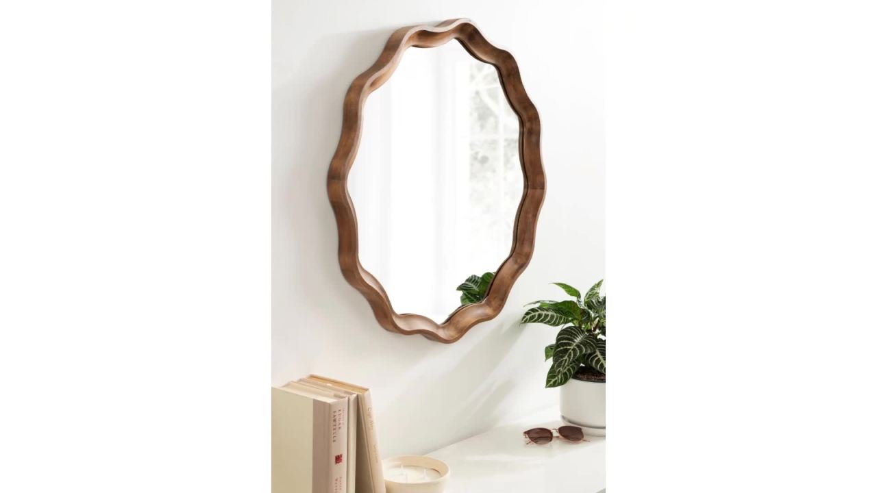 thumbnail video image 2 of Kate and Laurel Hatherleigh Transitional Round Wooden Wall Mirror, 28 Inch Diameter, Gold, Modern Scalloped Wavy Wood Circle Mirror for Use in Bathroom, Entryway, or Bedroom, 2 of 9