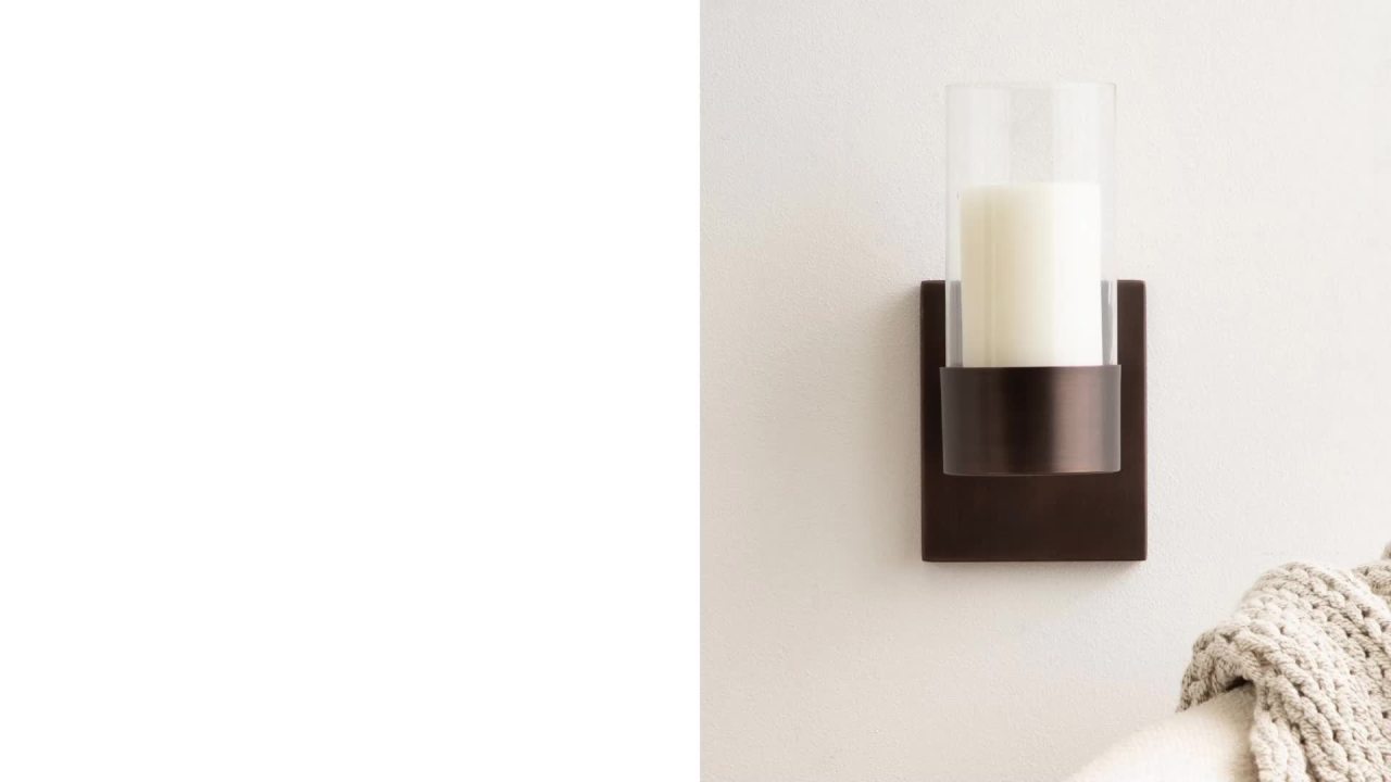 thumbnail video image 2 of Kate and Laurel Zabler Modern Metal Wall Sconce, 5 x 6 x 10, Black, Round Candle Holder with Removable Glass Cylinder for Flameless Candle Display in Bedroom or Bathroom, 2 of 10
